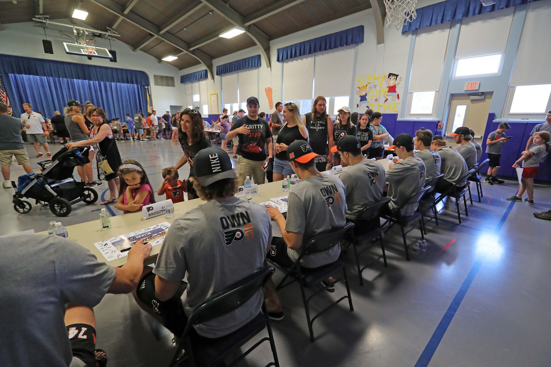 Philadelphia Flyers prospects sign autographs and play volleyball